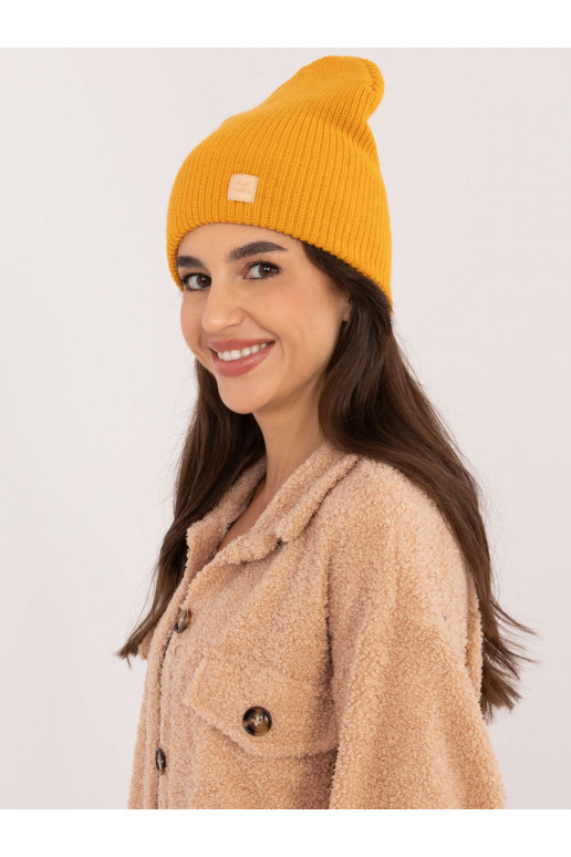 Kepurė tamsiai geltonos spalvos Kepurė tamsiai geltonos spalvos