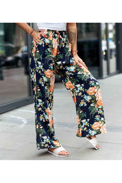 Tamsiai mėlynos plačios kelnės su... Tamsiai mėlynos plačios kelnės su...