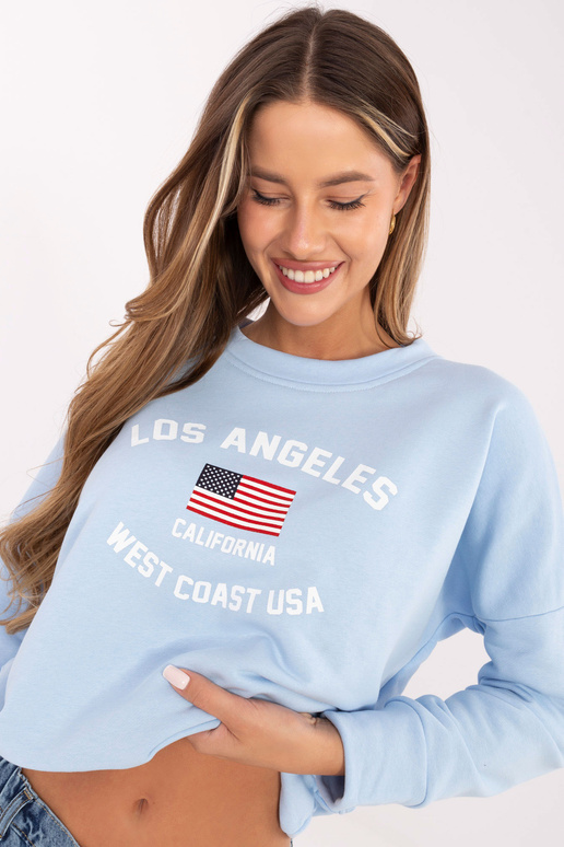 Šviesiai mėlynas megztinis su raštu...