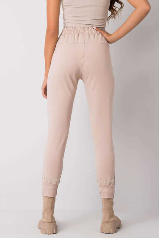 Smėlio spalvos sportinės kelnės su... Smėlio spalvos sportinės kelnės su...