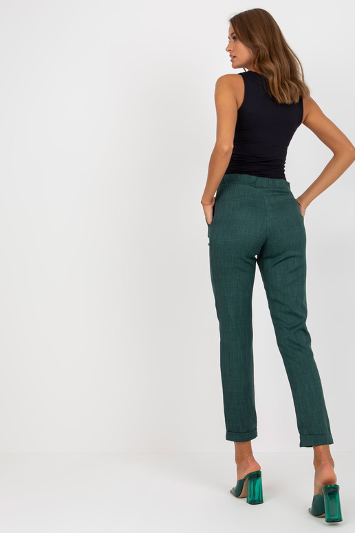 Tamsiai žalios elegantiškos kelnės iš...