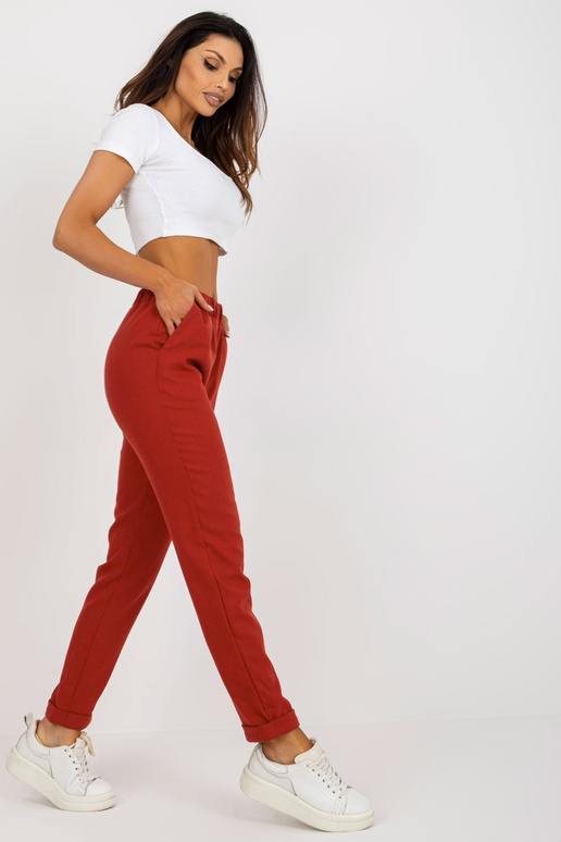 Tamsiai oranžinio audinio kelnės su...