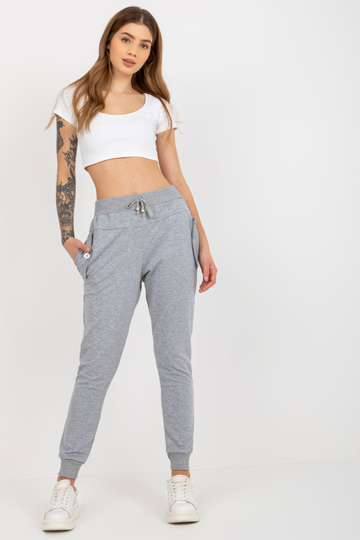 Pilkos moteriškos sportinės kelnės su... Pilkos moteriškos sportinės kelnės su...