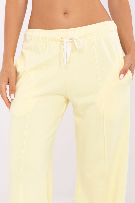 Sportinės kelnės šviesiai geltonos